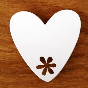 Heart magnet on wooden table