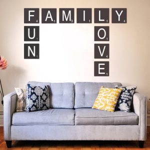 Scrabble vinyl on wall above couch